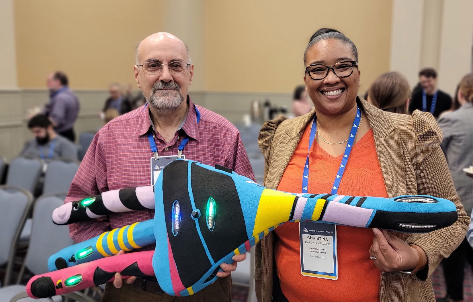 AI4K12 co-leaders Dave Touretzky and Christina Gardner-McCune display a plush neuron that’s also a digitally interactive teaching tool.