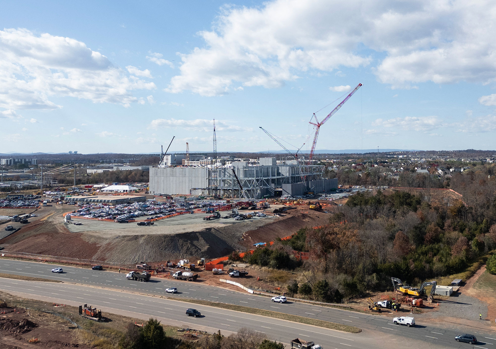 An aerial view shows cars passing a data center under construction in Ashburn, Virginia.